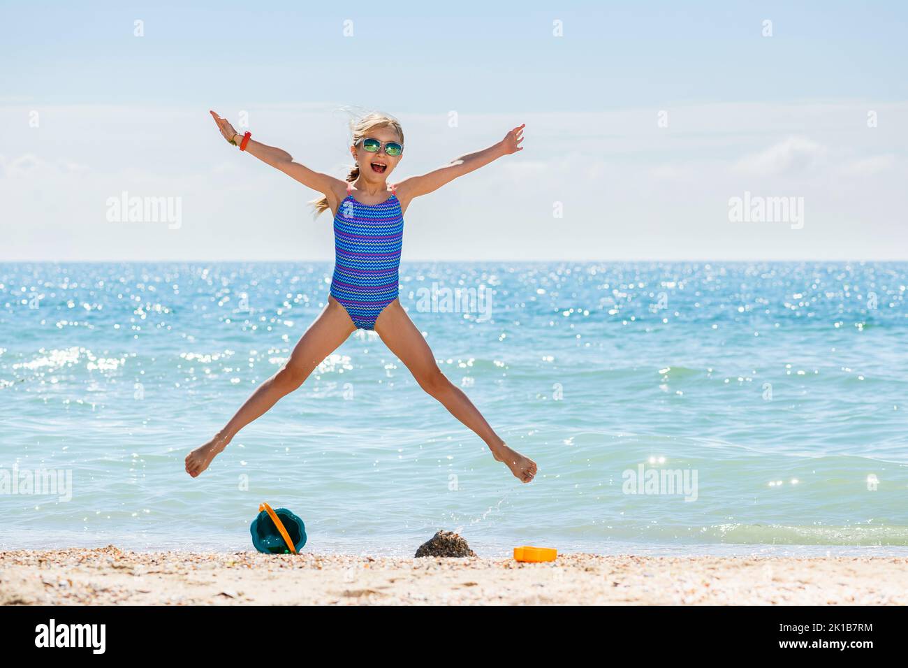 Little girl in swimsuit jumping hires stock photography and images Alamy