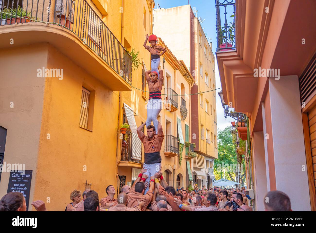 CAMBRILS, SPAIN - SEPTEMBER 04.2022: Castells Performance, a castell is a human tower built traditionally in festivals within Tarragona, Catalonia Stock Photo