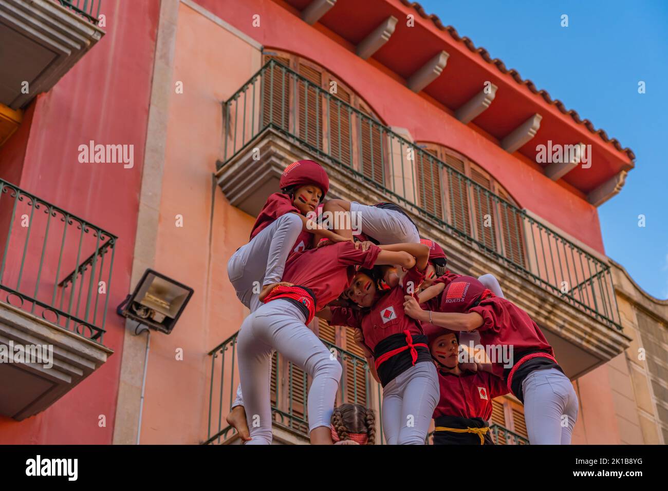CAMBRILS, SPAIN - SEPTEMBER 04.2022: Castells Performance, a castell is a human tower built traditionally in festivals within Tarragona, Catalonia Stock Photo