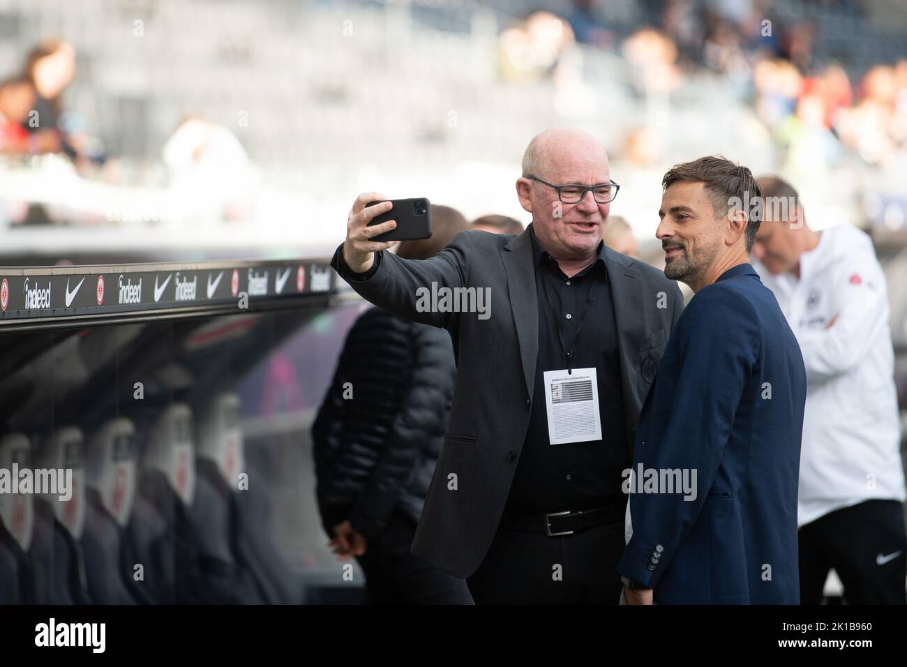 Frankfurt, Germany. 16th Sep, 2022. 16 September 2022, Hessen, Frankfurt/Main: Soccer, Women: Bundesliga, Eintracht Frankfurt - Bayern Munich, Matchday 1, Deutsche Bank Park. Siegfried Dietrich, sports director of the Eintracht Frankfurt women's team, and coach Niko Arnautis take a selfie. Photo: Sebastian Gollnow/dpa - IMPORTANT NOTE: In accordance with the requirements of the DFL Deutsche Fußball Liga and the DFB Deutscher Fußball-Bund, it is prohibited to use or have used photographs taken in the stadium and/or of the match in the form of sequence pictures and/or video-like photo series. Cr Stock Photo