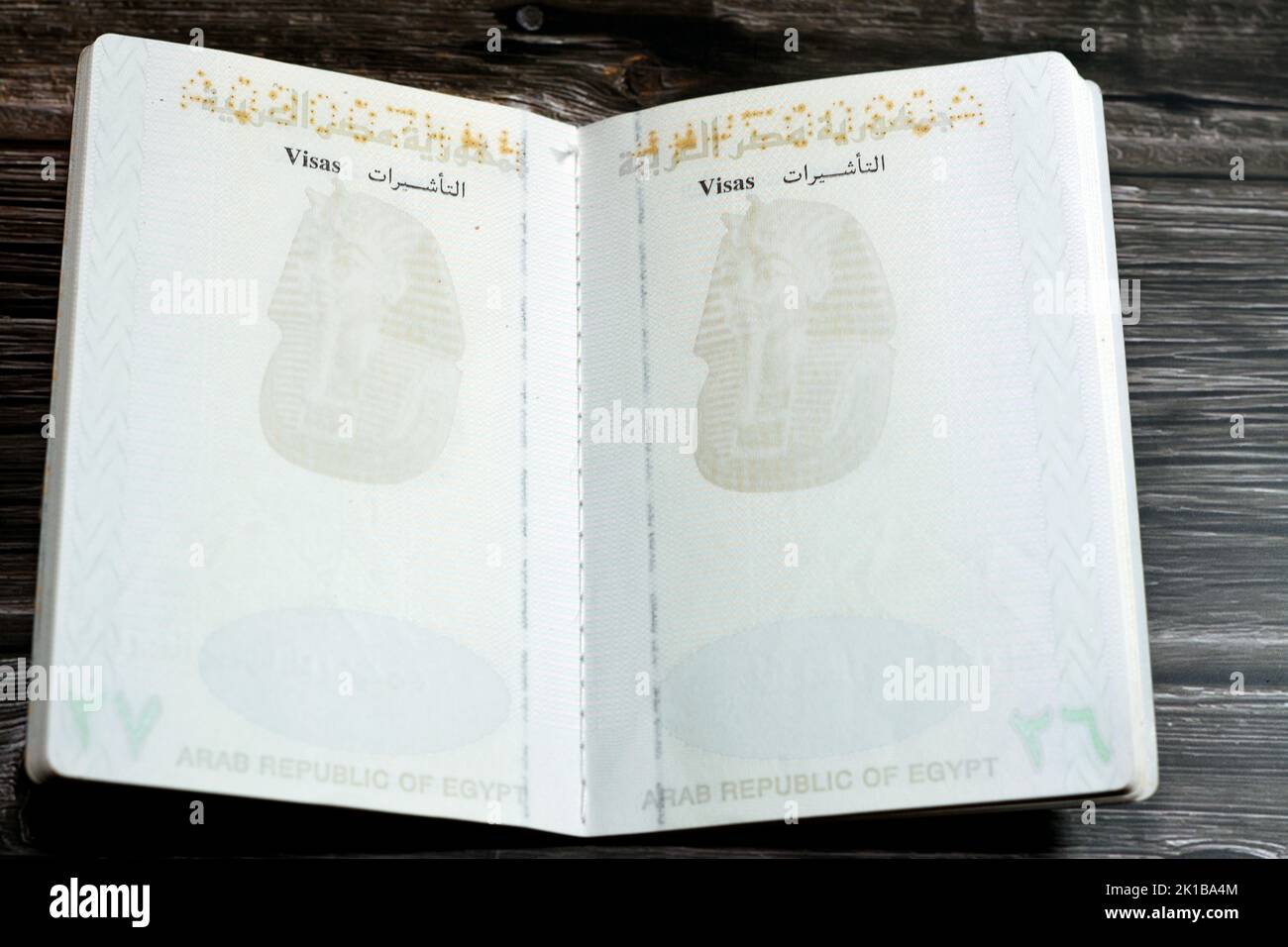 Egyptian passport isolated on wooden background, Arab republic of Egypt