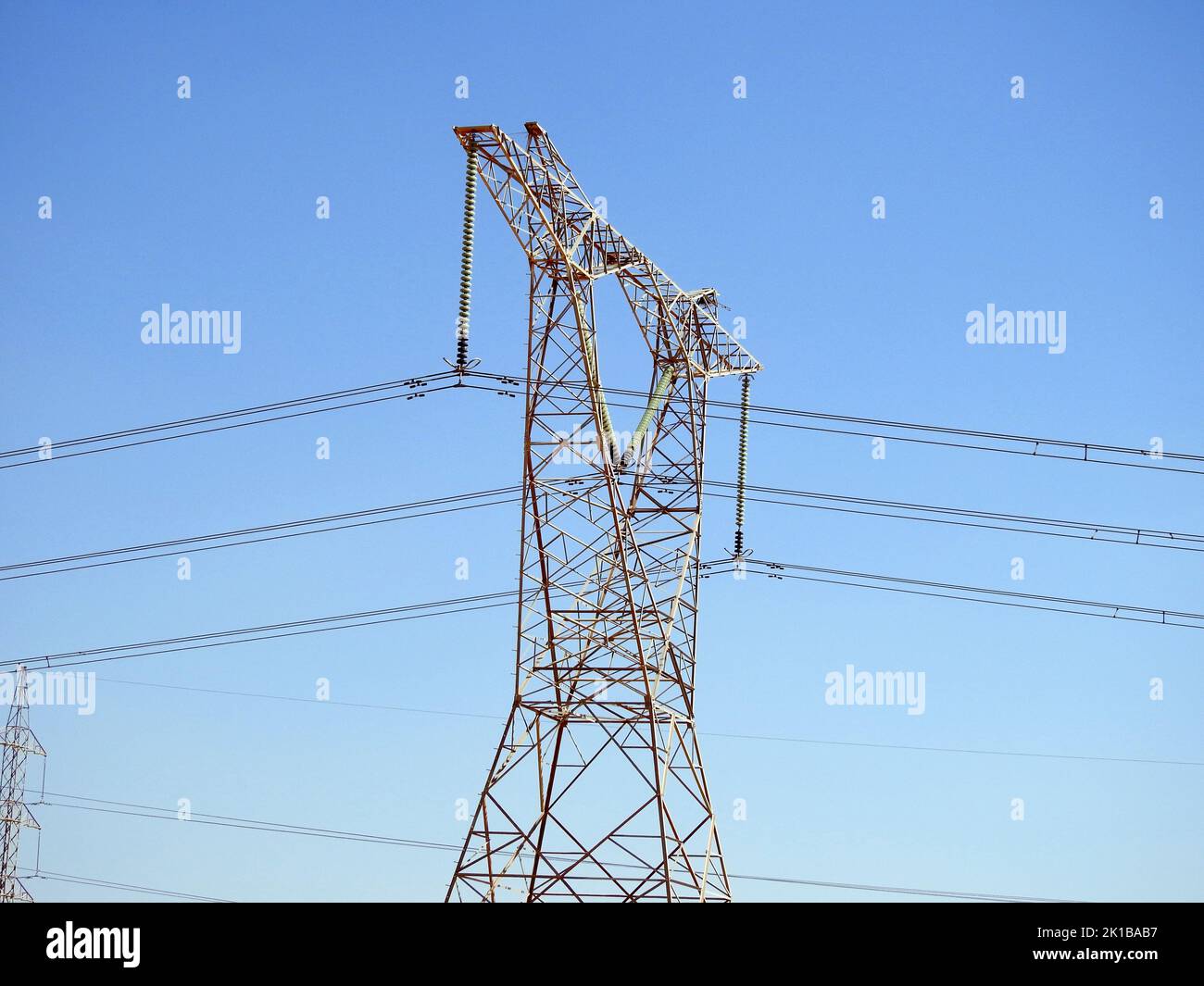 A transmission tower, electricity pylon which is a tall steel lattice structure that used to support overhead high voltage power lines, high voltage e Stock Photo