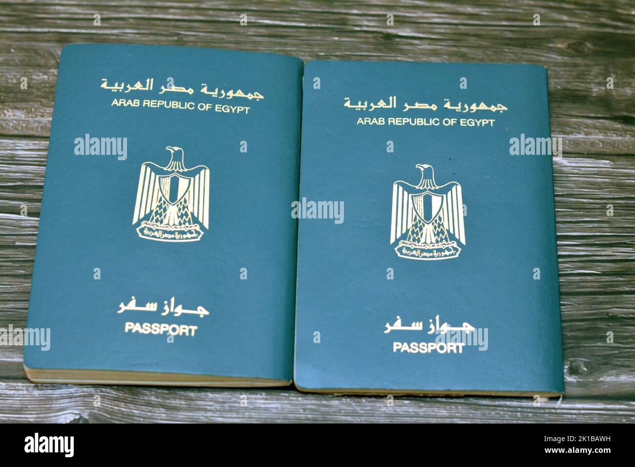 Egyptian passport isolated on wooden background, Arab republic of Egypt
