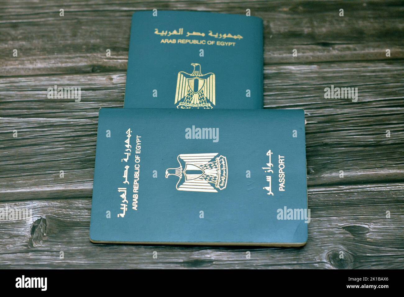 Egyptian passport isolated on wooden background, Arab republic of Egypt