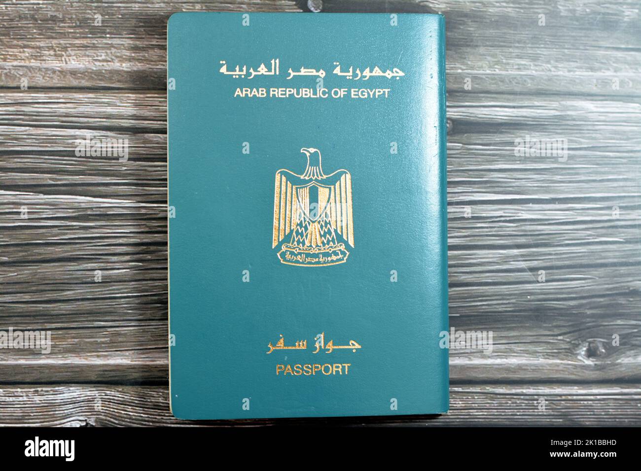 Egyptian passport isolated on wooden background, Arab republic of Egypt