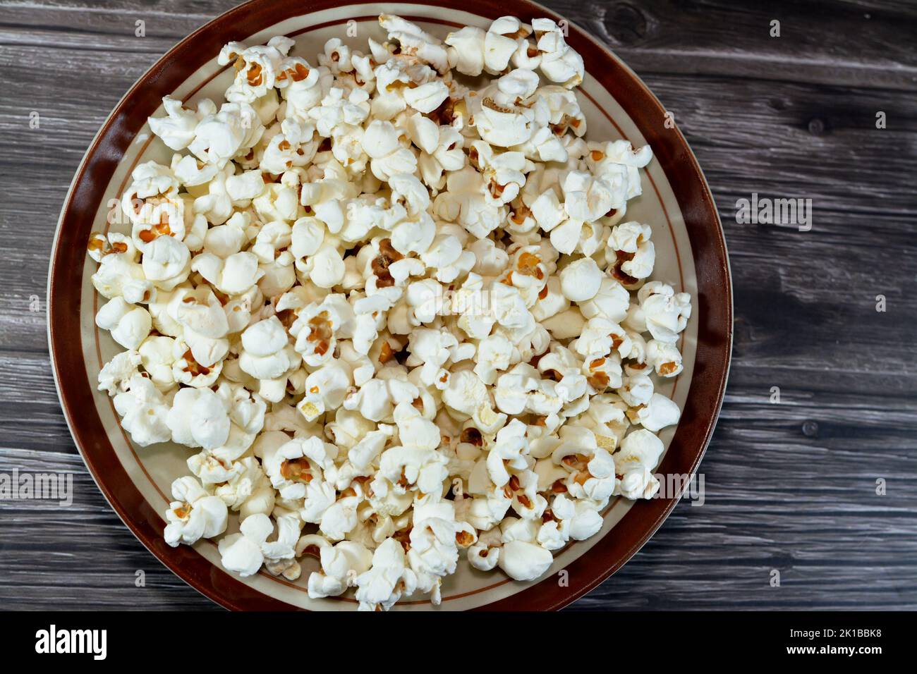 A plate of Popcorn and also called popped corn, popcorns or popcorn