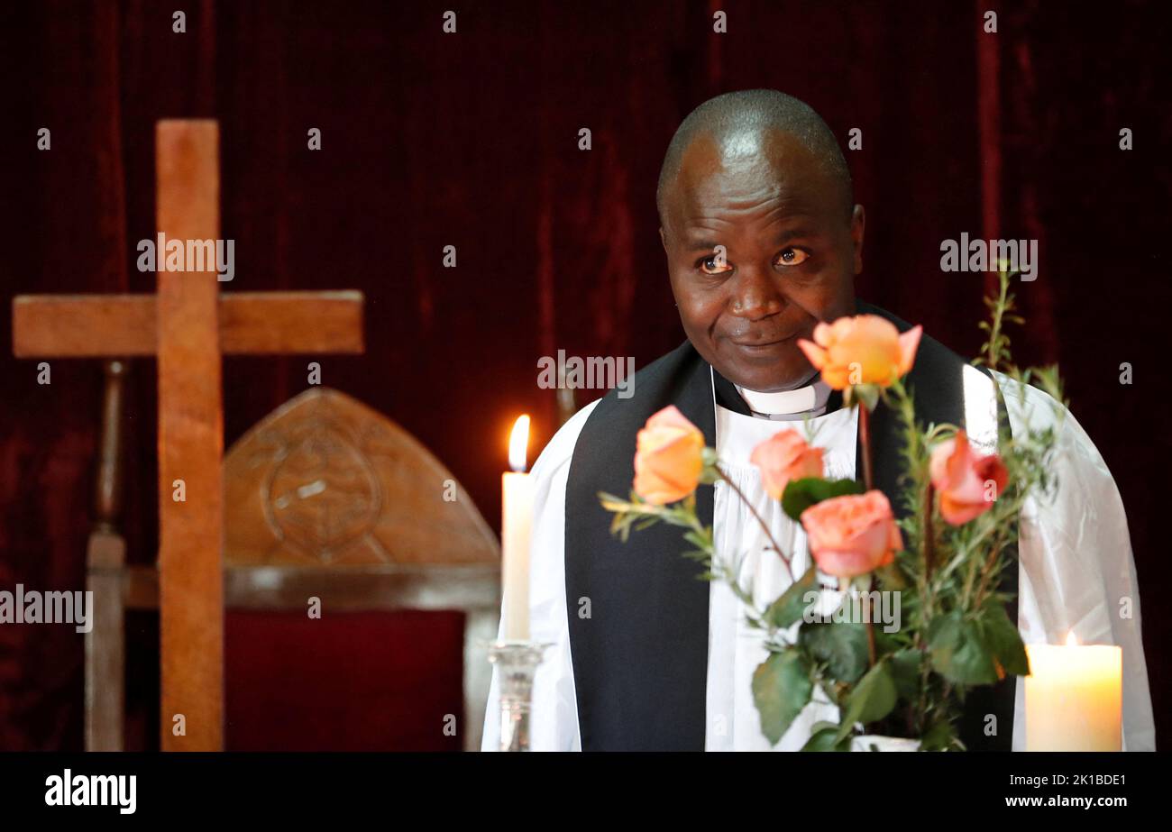 Arch-Decon Samuel Mwangi Waweru leads a thanksgiving memorial service for the late Queen Elizabeth II, at the St Philips Anglican Church of Kenya in Naro Moru, Kenya September 17, 2022. REUTERS/Thomas Mukoya Stock Photo