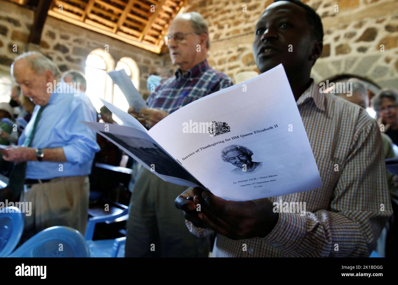 Congregants sing hymns as they attend a thanksgiving memorial service for the late Queen Elizabeth II, at the St Philips Anglican Church of Kenya in Naro Moru, Kenya September 17, 2022. REUTERS/Thomas Mukoya Stock Photo