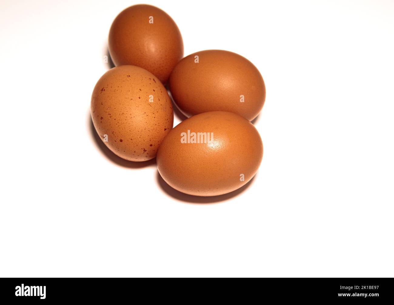 Four brown egg isolated on white background Stock Photo Alamy