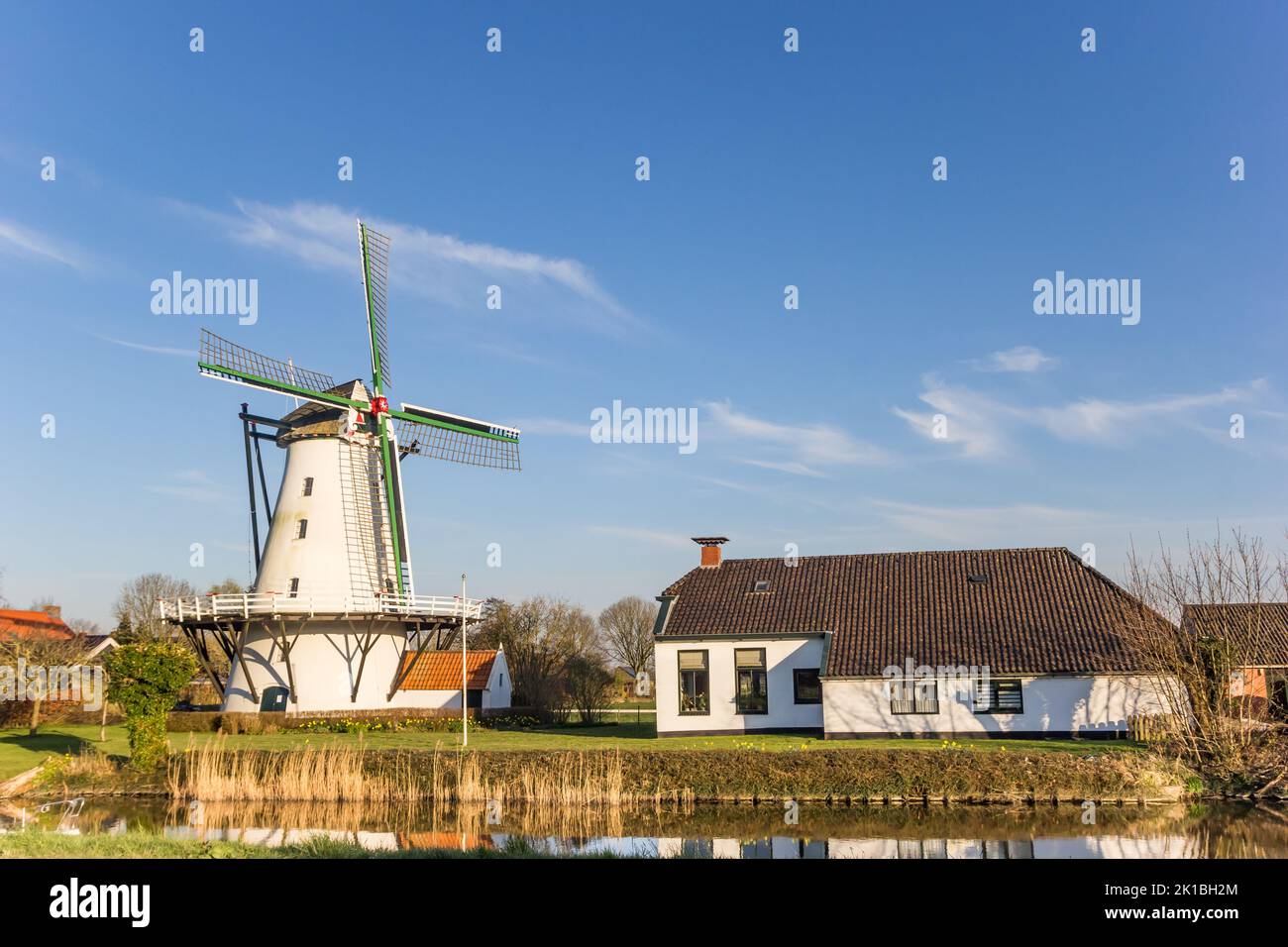 Historic windmill at the Damsterdiep river in Ten Boer, Netherlands Stock Photo