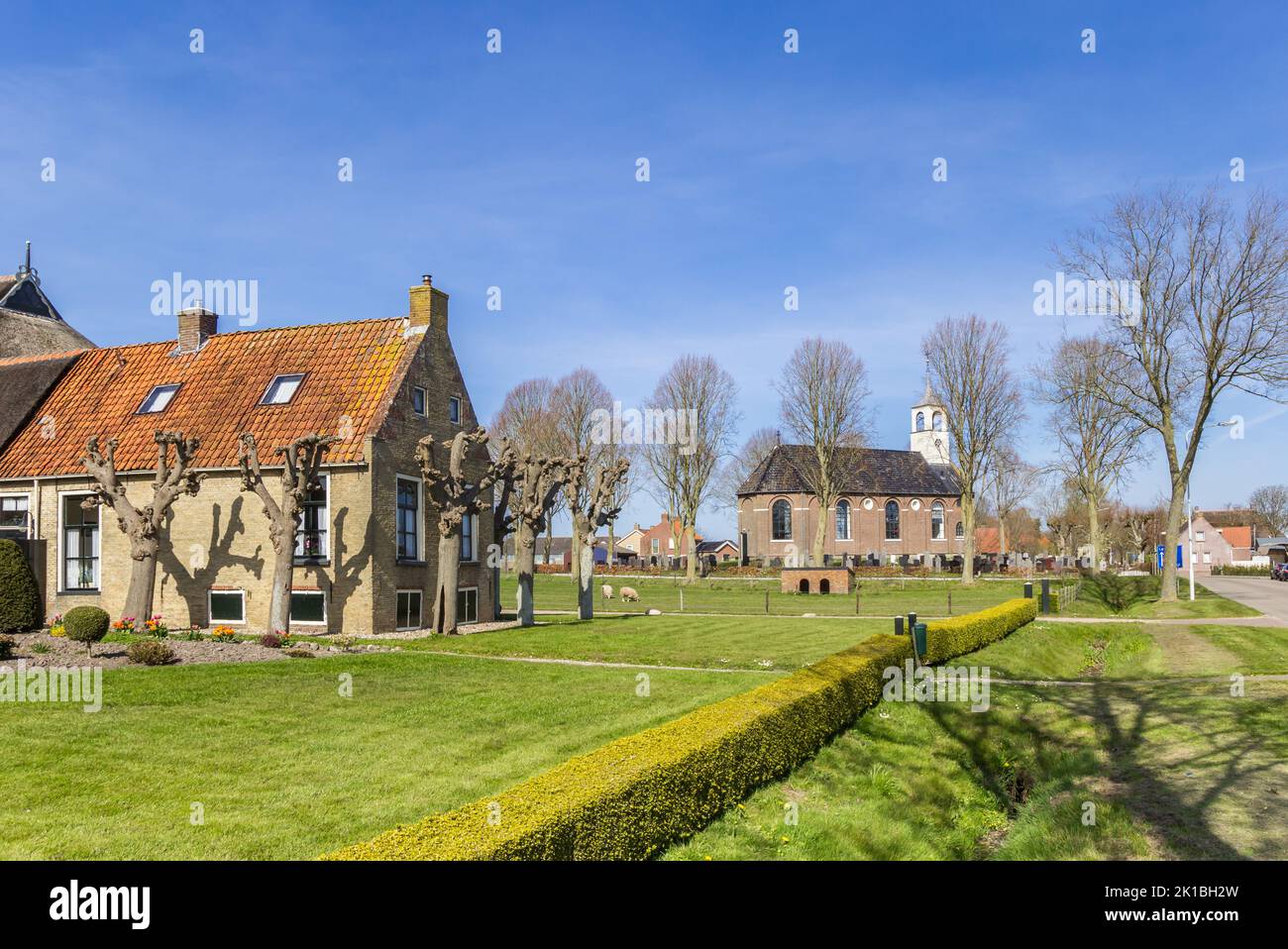 Historic farm and church in small town Sondel, Netherlands Stock Photo