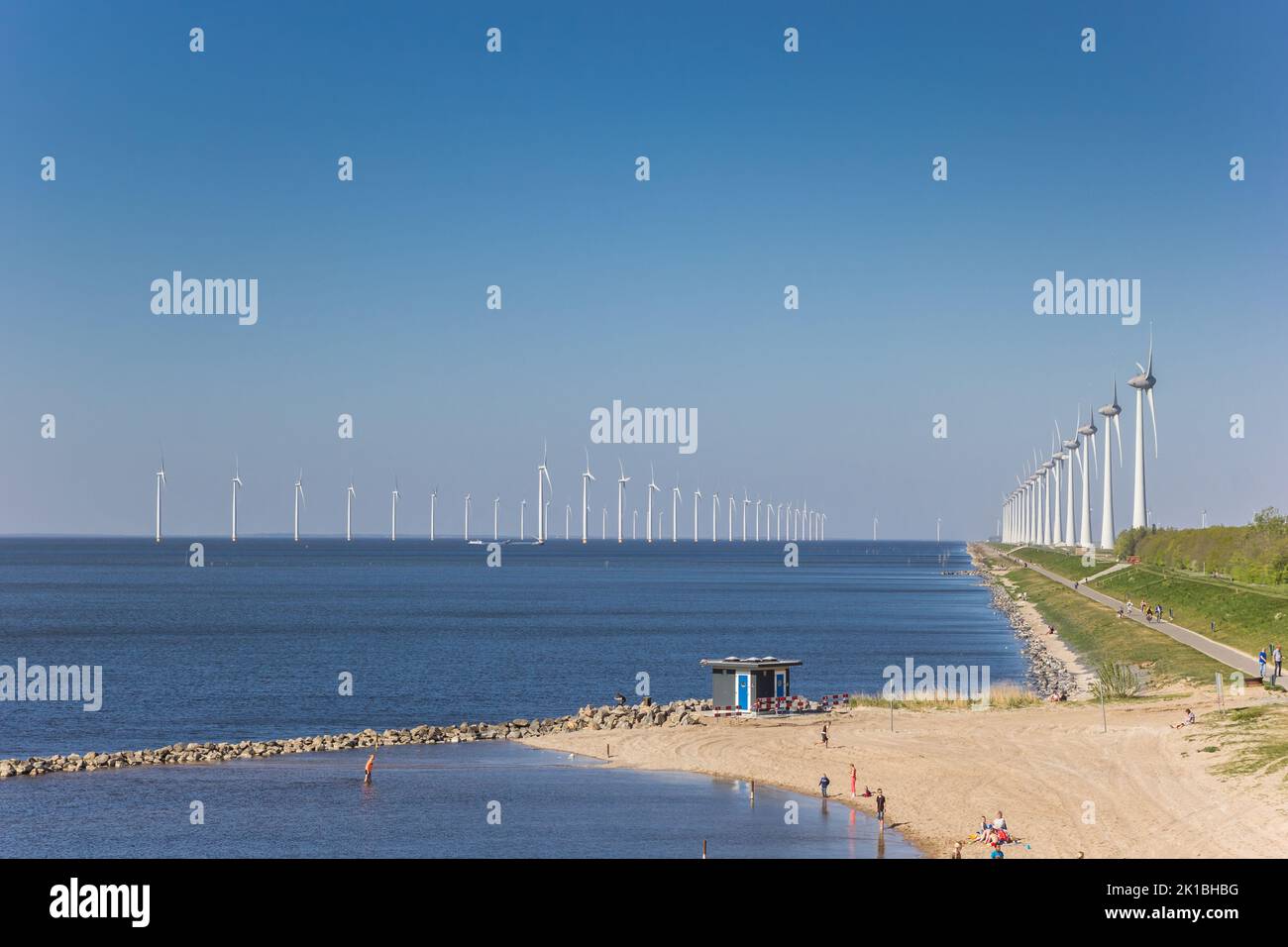 Beach and windturbines at the dike in Urk, Netherlands Stock Photo