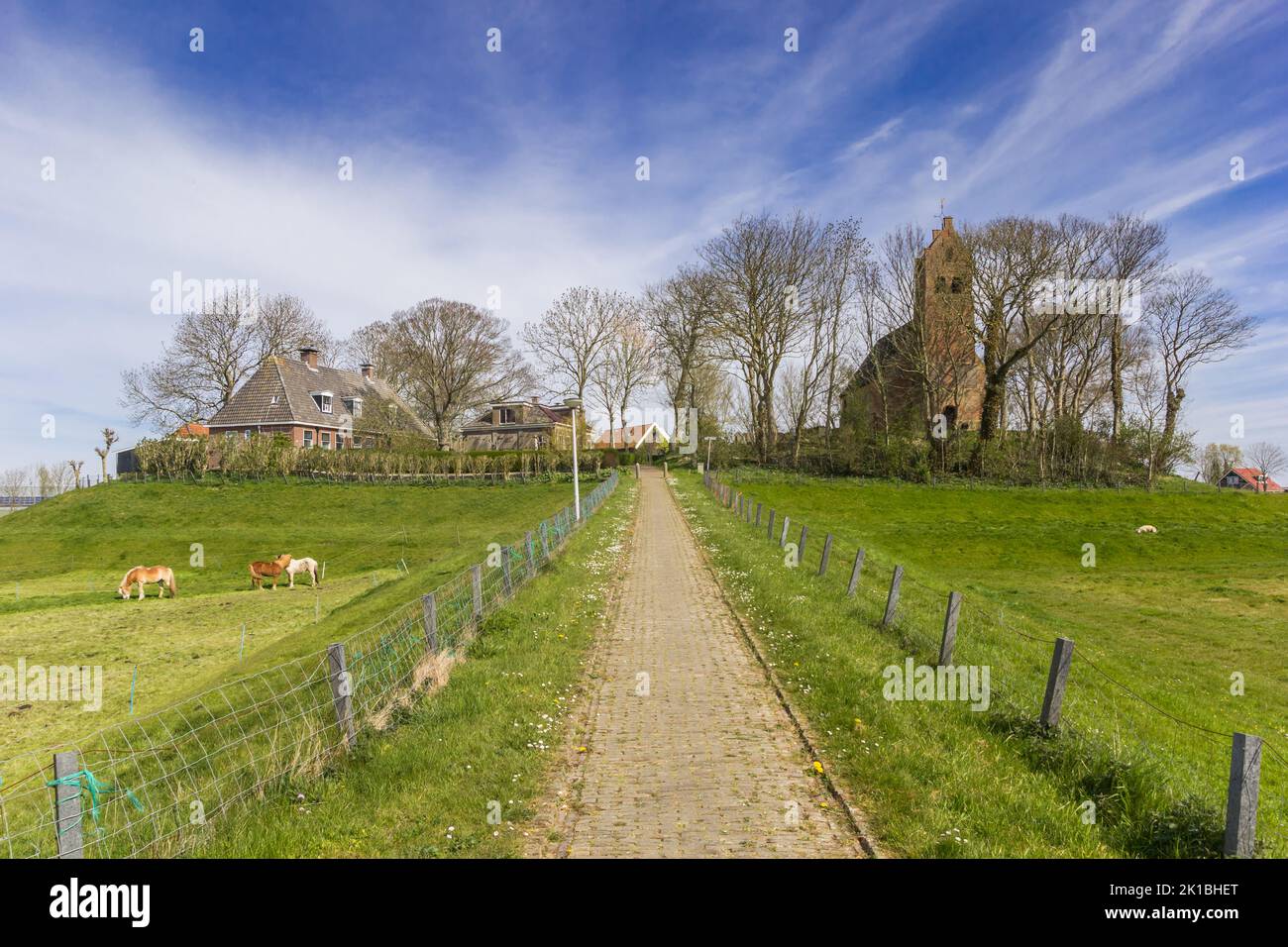 Path leading up to the historic church of Hegebeintum, Netherlands Stock Photo