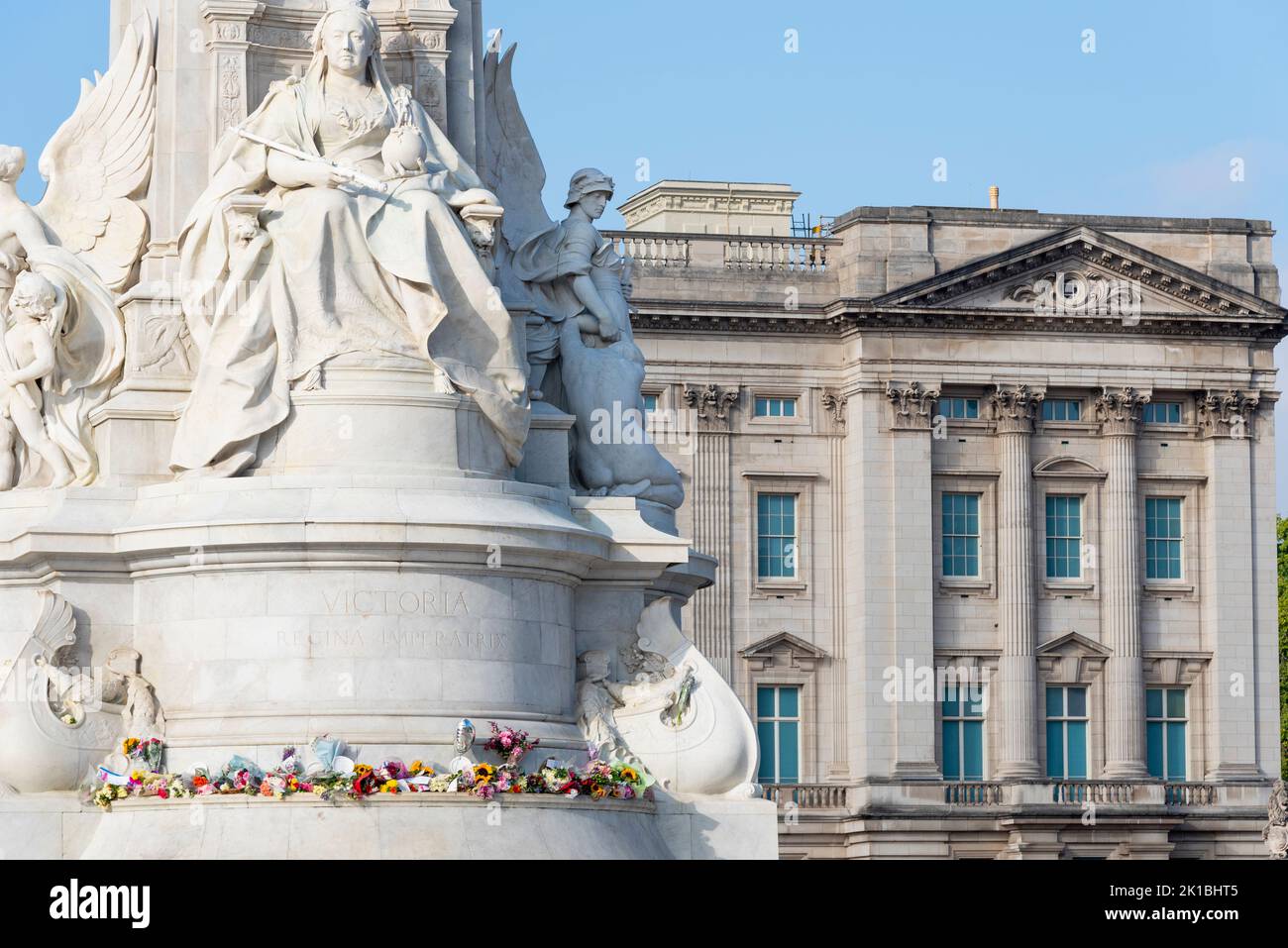 Flowers laid around bronze statue of Victoria Memorial outside