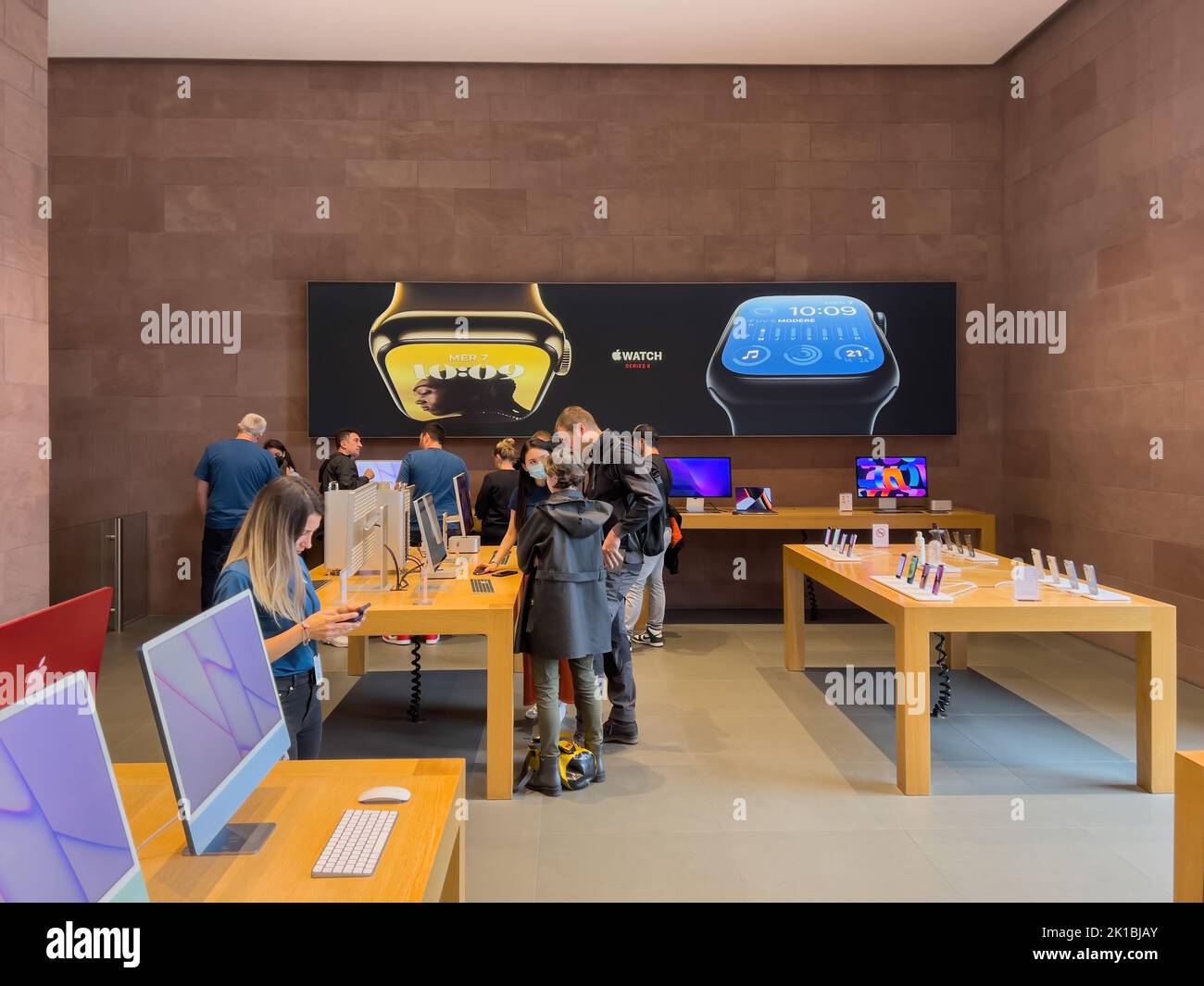 Paris, France - Sep 16, 2022: Busy crowd inspecing new Apple iMac ...