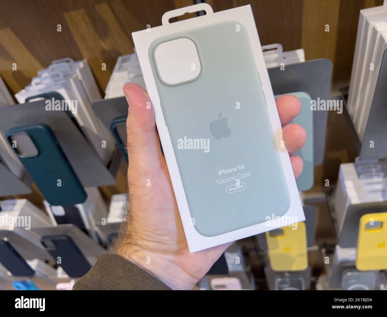 Paris, France - Sep 16, 2022: POV male hand holding package in Apple ...