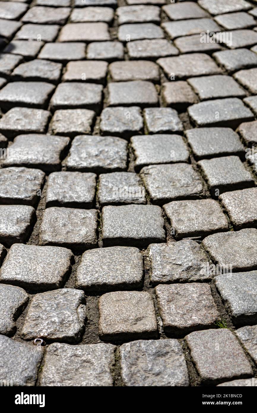 Cobblestone paving on old road background texture Stock Photo