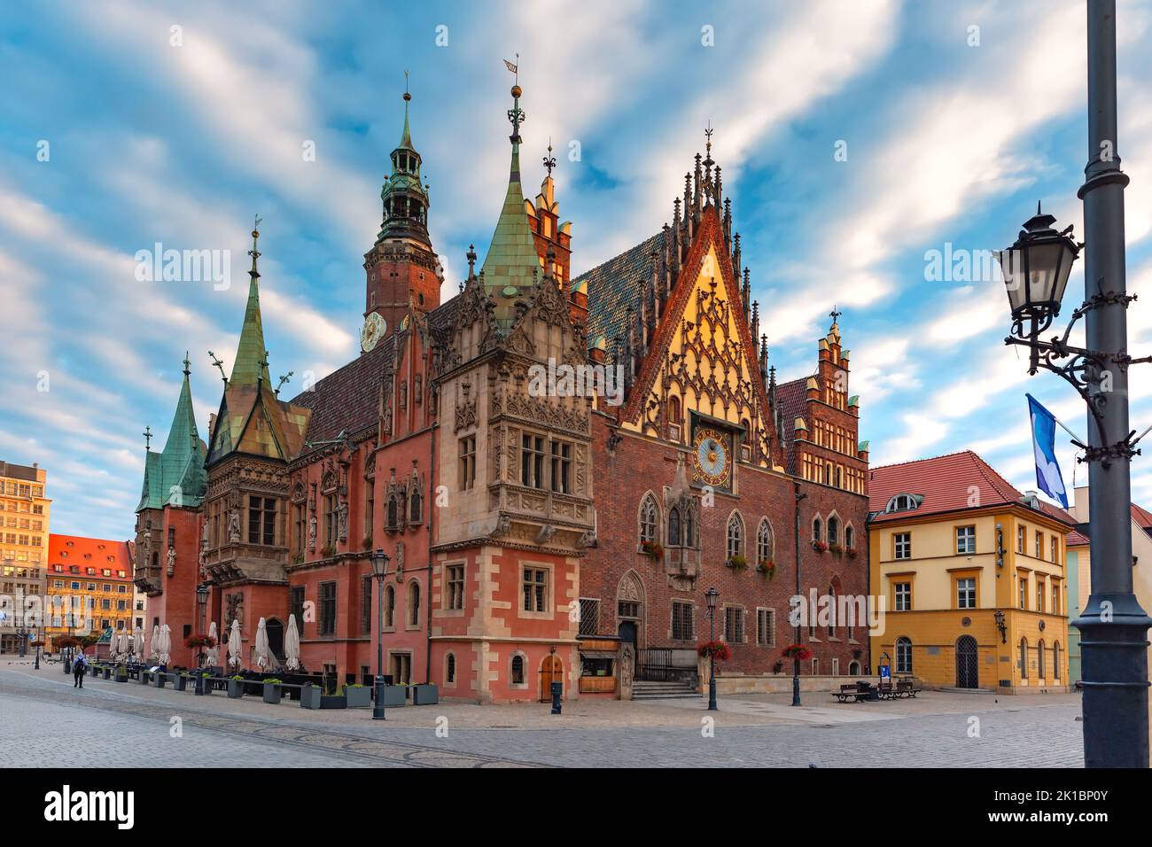 Multicolored traditional historical houses and City Hall on Market square at sunset, Old Town of Wroclaw, Poland Stock Photo