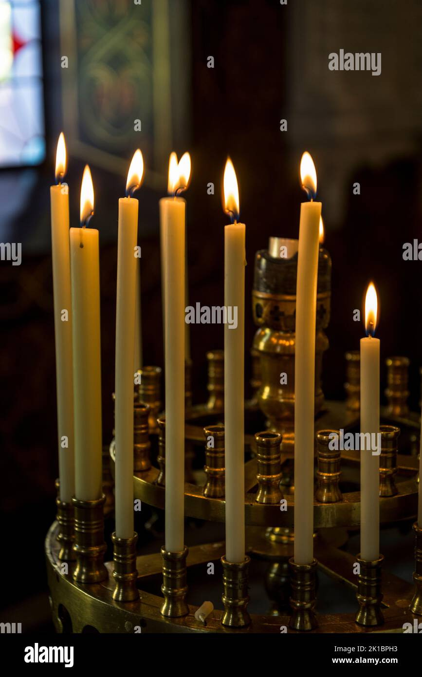 Lighted church candles Stock Photo