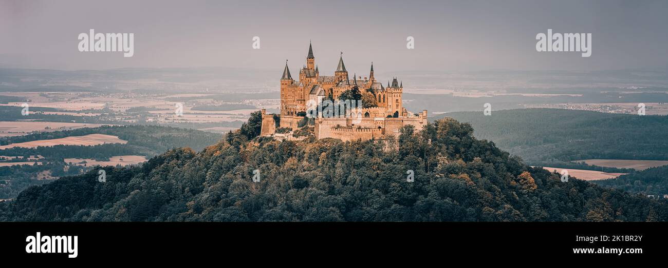 A wide panoramaic view on Hohenzollern Castle the ancestral seat of the imperial House of Hohenzollern. The third of three hilltop castles built on th Stock Photo