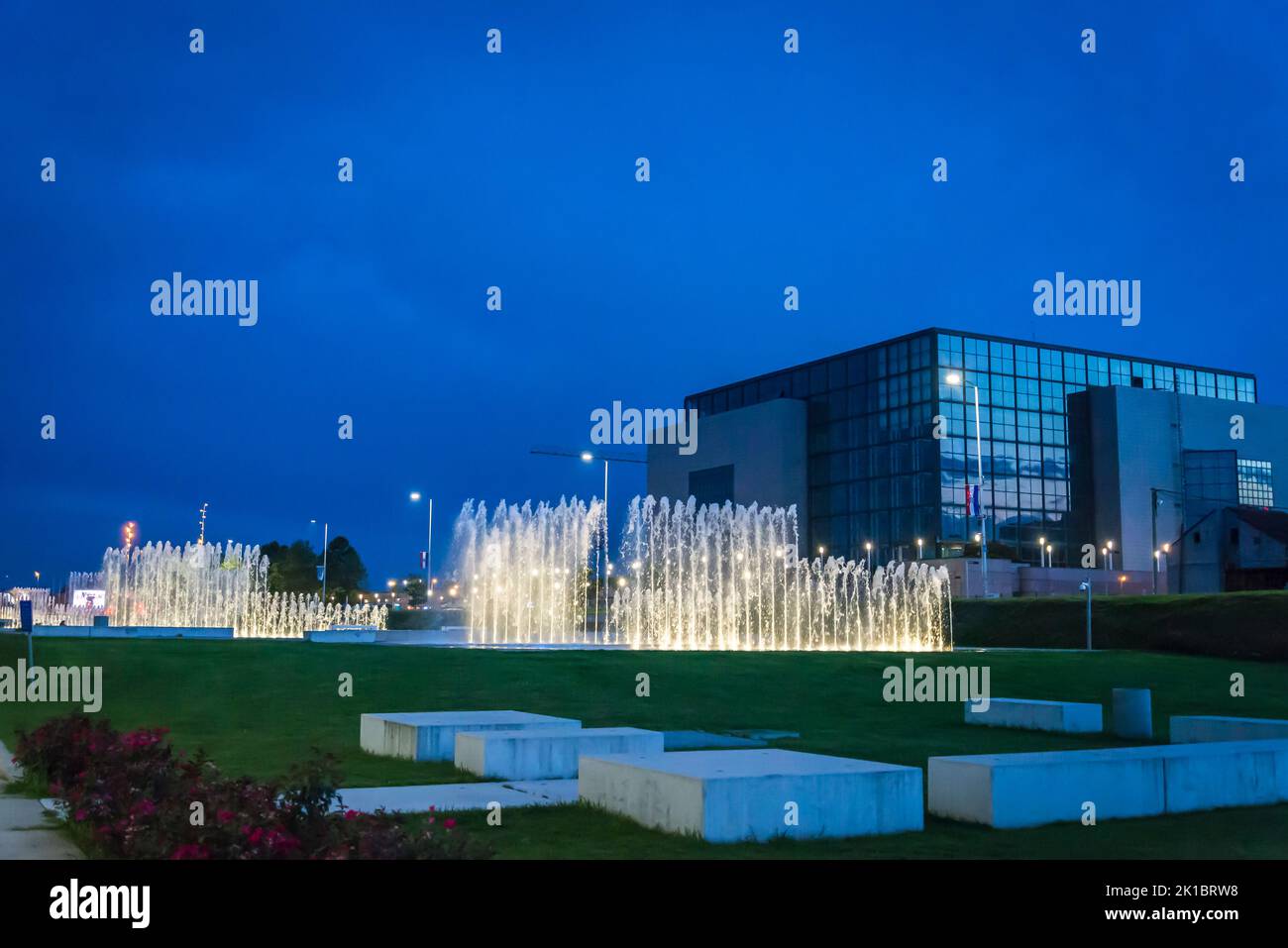 National and University Library at night and fountains in the Park of Fountains at the avenue of Hrvatske Bratske Zajednice, Zagreb, Croatia Stock Photo