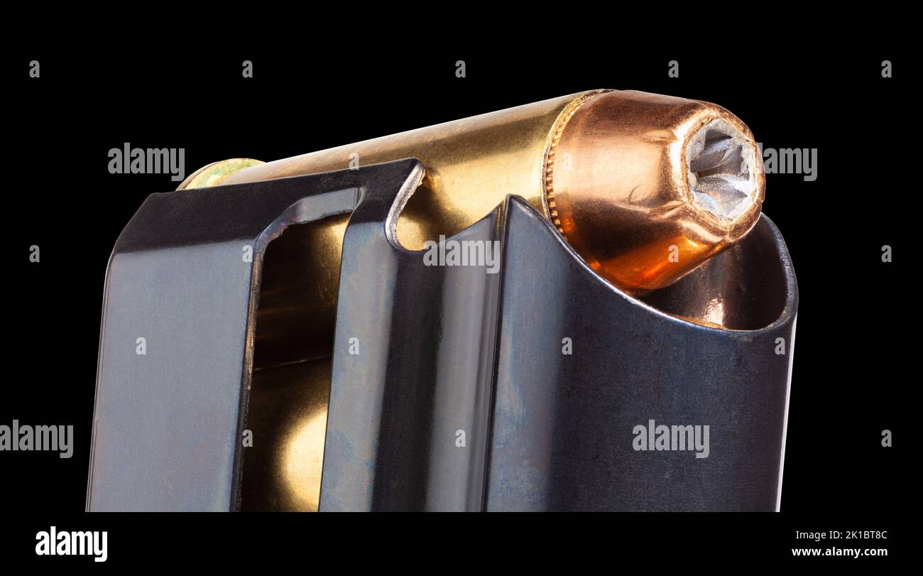 Hollow point bullets in a gun magazine with a black background Stock Photo Alamy