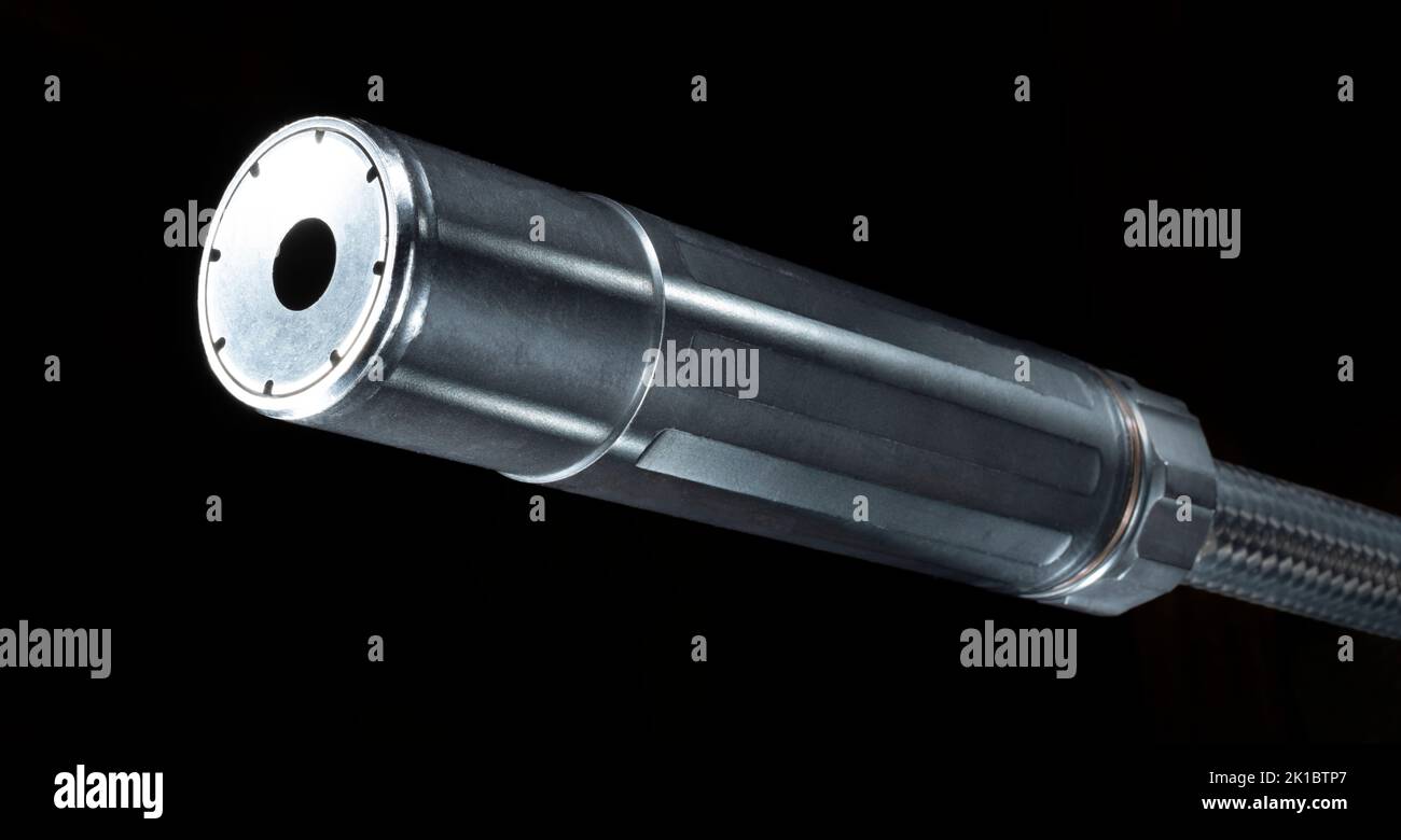 Carbon fiber rifle barrel with suppressor attached on a black