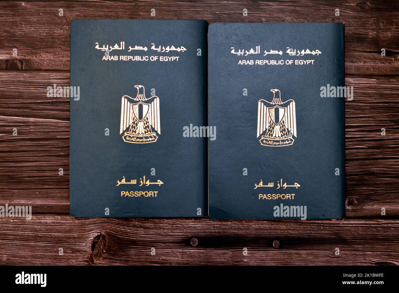 Egyptian passport isolated on wooden background, Arab republic of Egypt