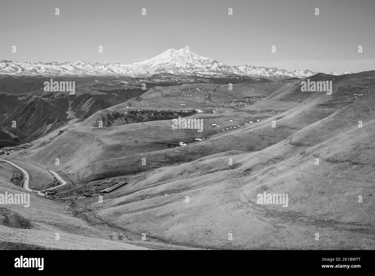 Black white panorama of Mount Elbrus against the backdrop of the Main Caucasian Range. Karachay-Cherkessia. Russia. Stock Photo