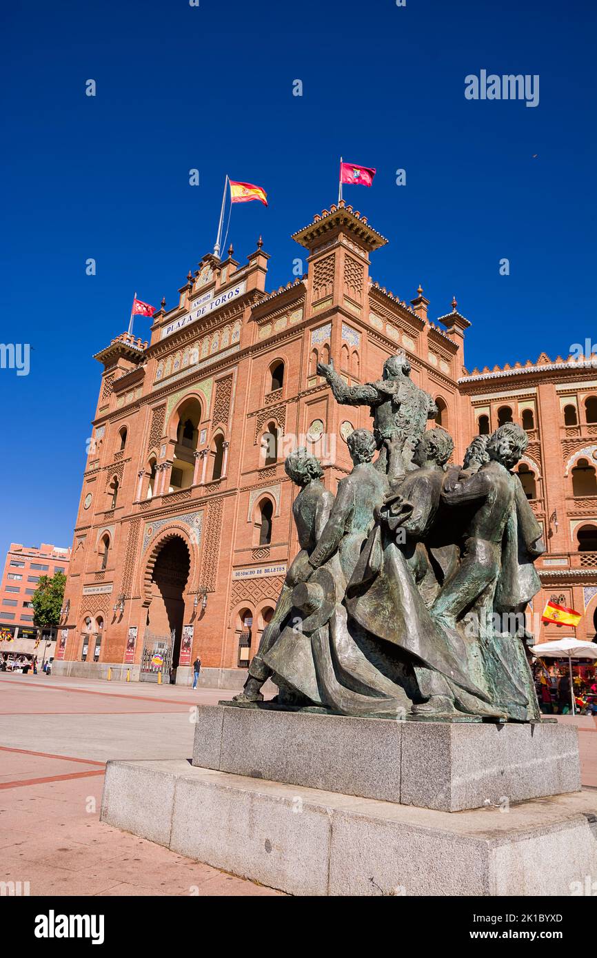 Madrid, Spain - June 19, 2022: Monument to the bullfighters in the foreground and facade and main entrance of Plaza de Toros in Madrid Stock Photo