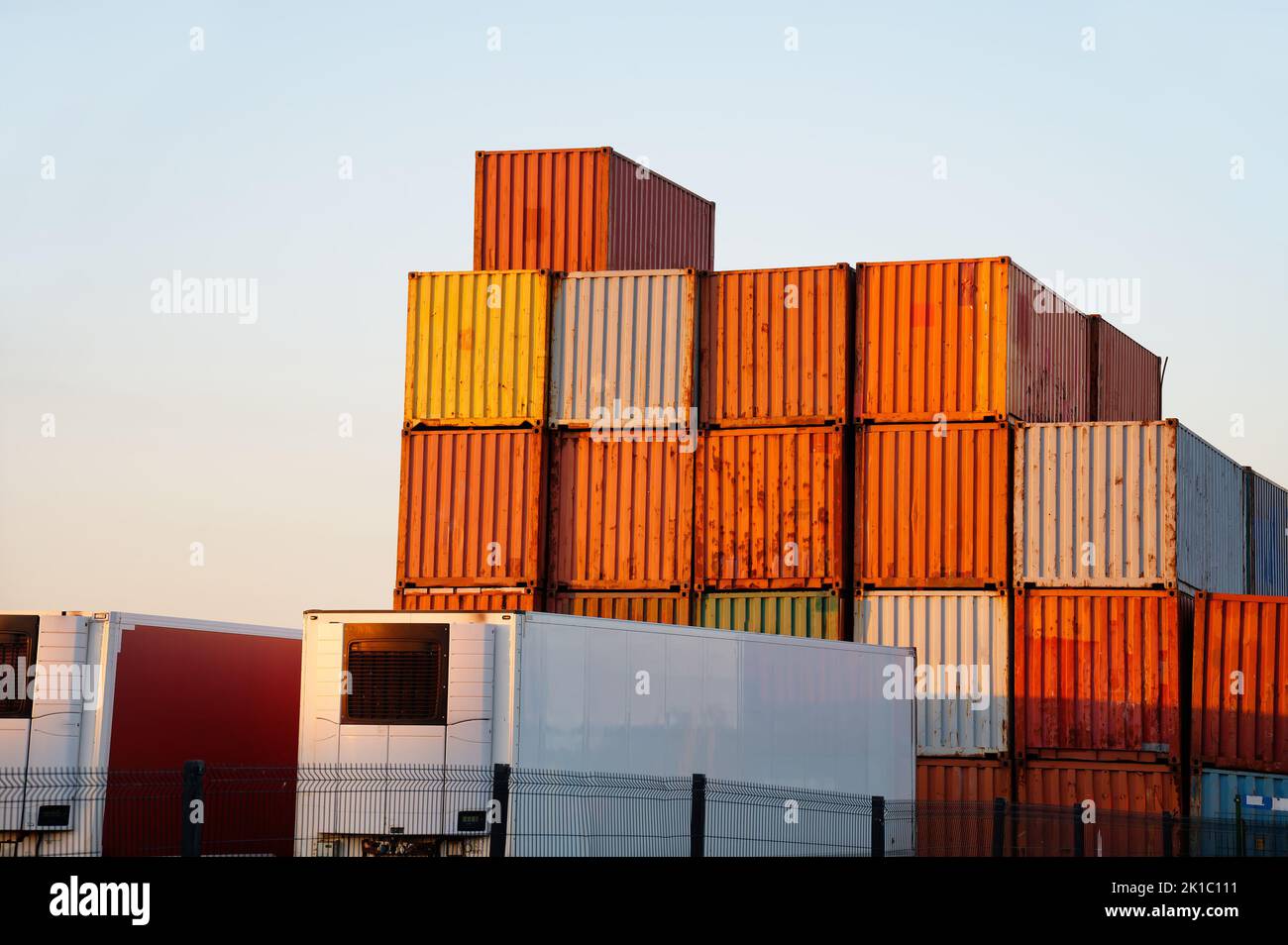 Cargo containers stacked high at logistics port town of Greenock Stock Photo