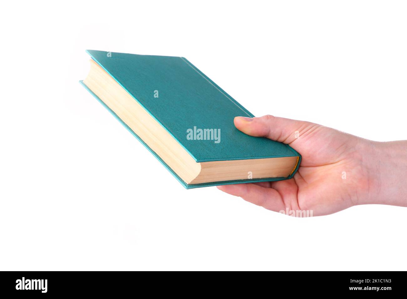 Hand holding old book isolated on