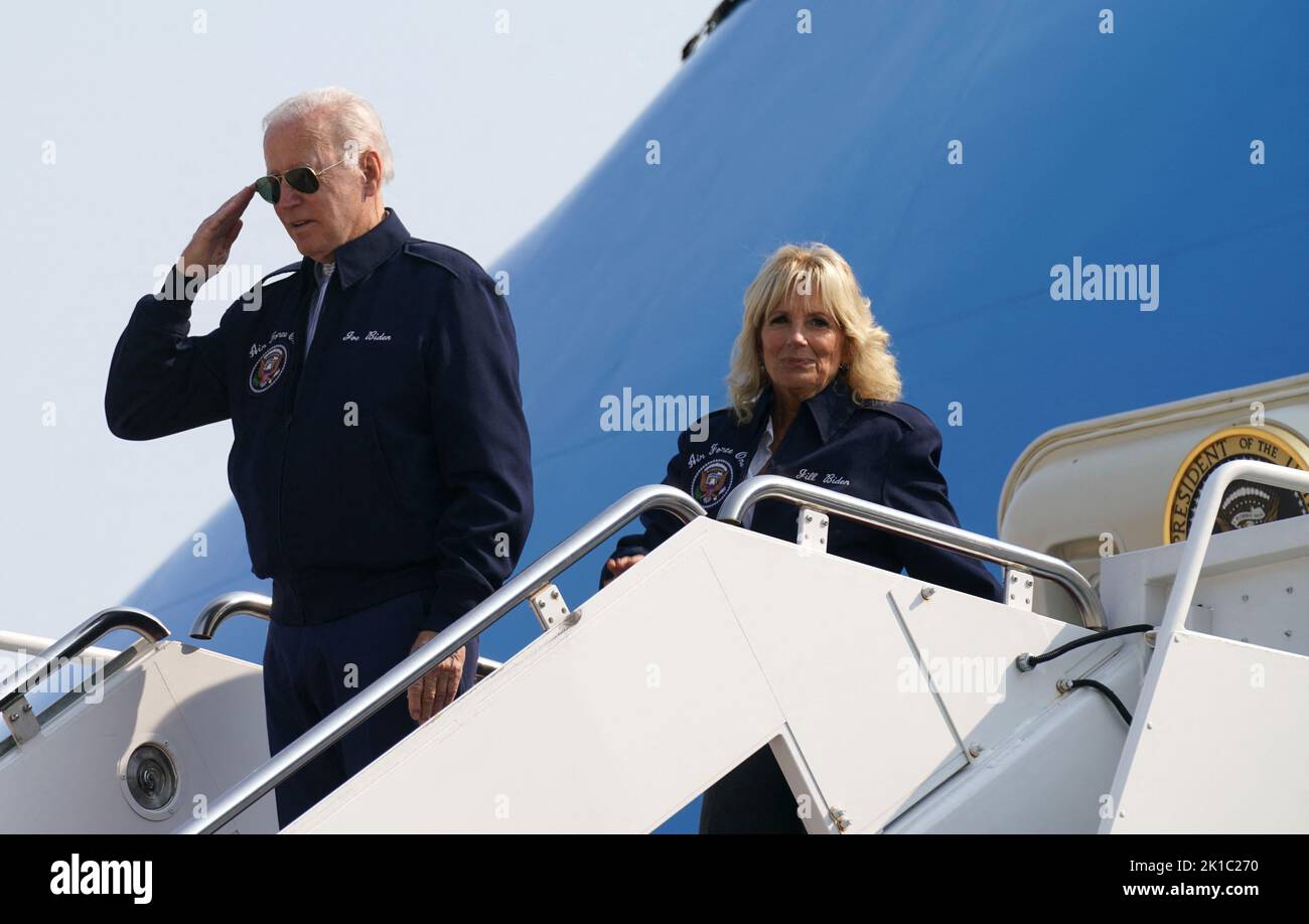U.S. President Joe Biden salutes as he and first lady Jill Biden board Air Force One as they depart for London to attend the funeral of Britain's Queen Elizabeth, from Joint Base Andrews in Maryland, U.S., September 17, 2022. REUTERS/Kevin Lamarque Stock Photo