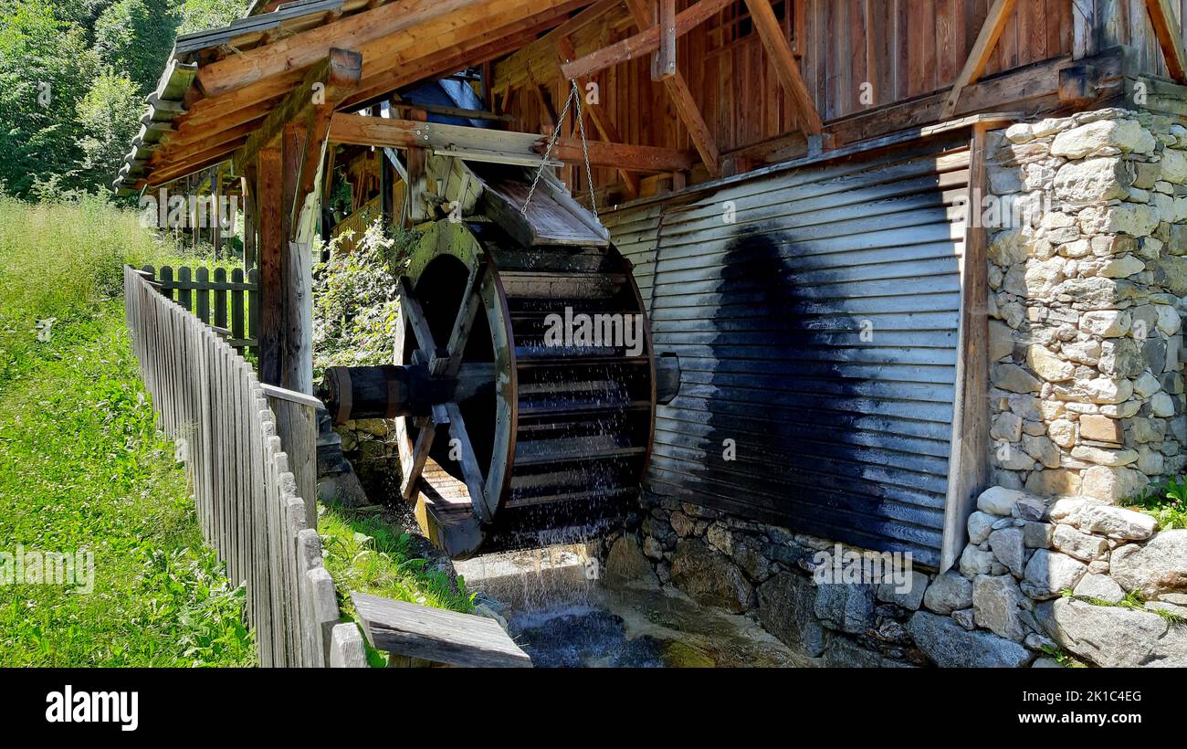 The large water-powered wheel that drives the Lipper Sage, an ancient sawmill located in the village of Valdaora di Sopra Stock Photo