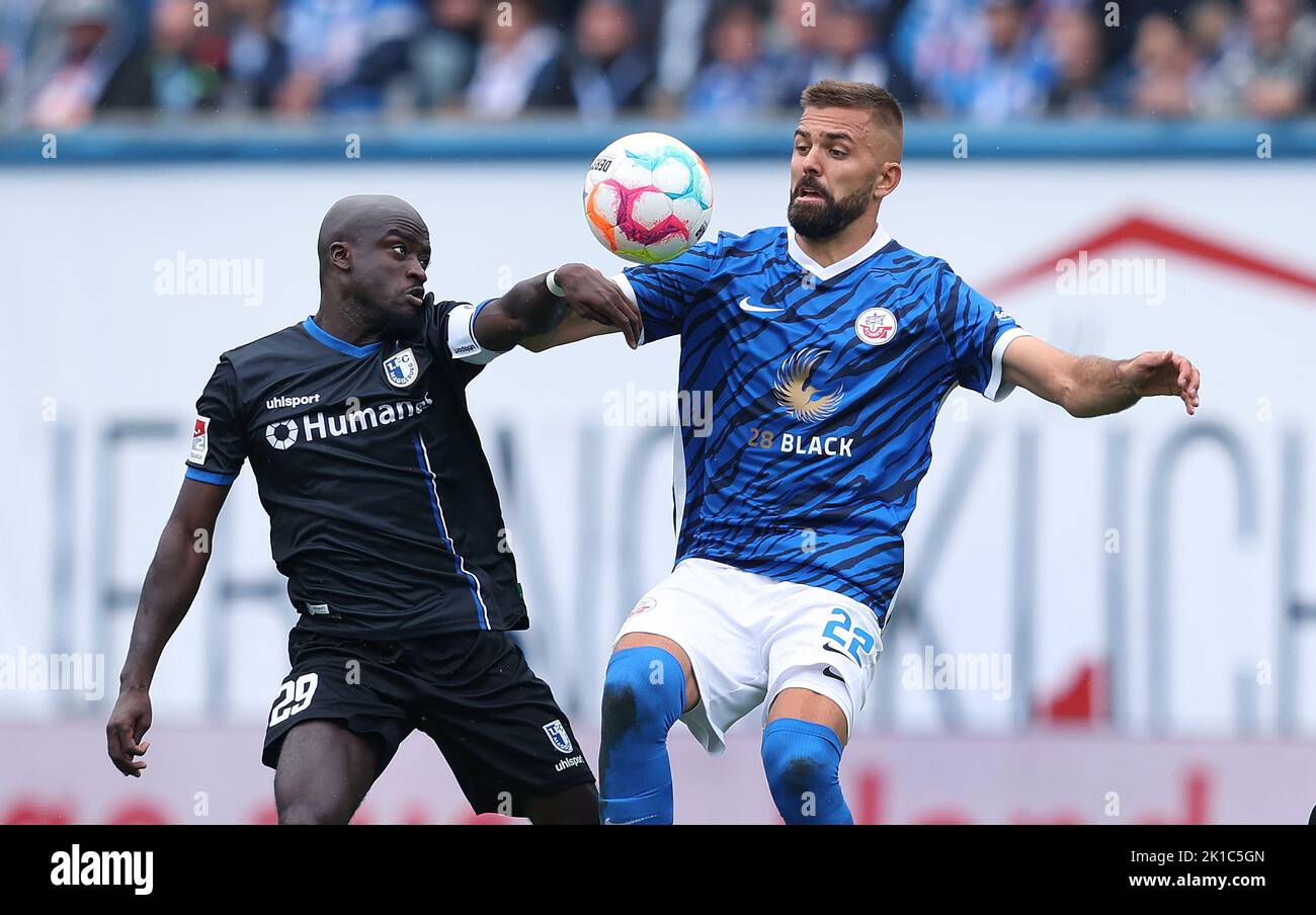 Rostock, Germany. 17th Sep, 2022. Soccer: 2nd Bundesliga, Hansa Rostock - 1.  FC Magdeburg, Matchday 9, Ostseestadion. Rostock's Lukas Hinterseer (r)  against Magdeburg's Amara Conde. Credit: Ronny Hartmann/dpa-Zentralbild/dpa  - IMPORTANT NOTE: In