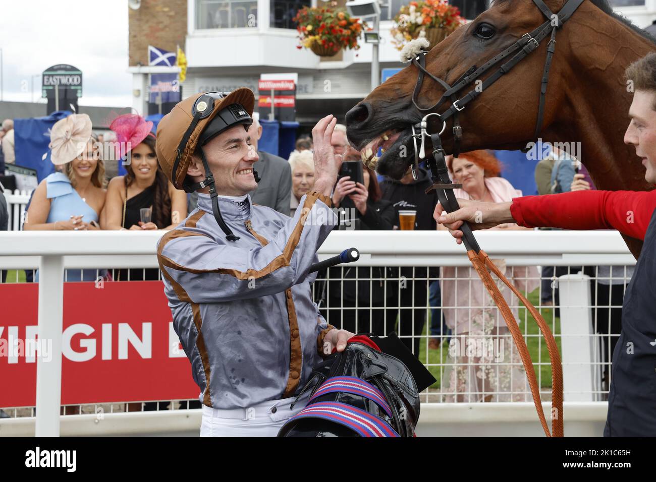Summerghand and jockey Daniel Tudhope in the parade ring after winning the Virgin Bet Ayr Gold Cup Handicap during the Virgin Bet Ayr Gold Cup day at Ayr Racecourse, Ayr. Picture date: Saturday September 17, 2022. Stock Photo