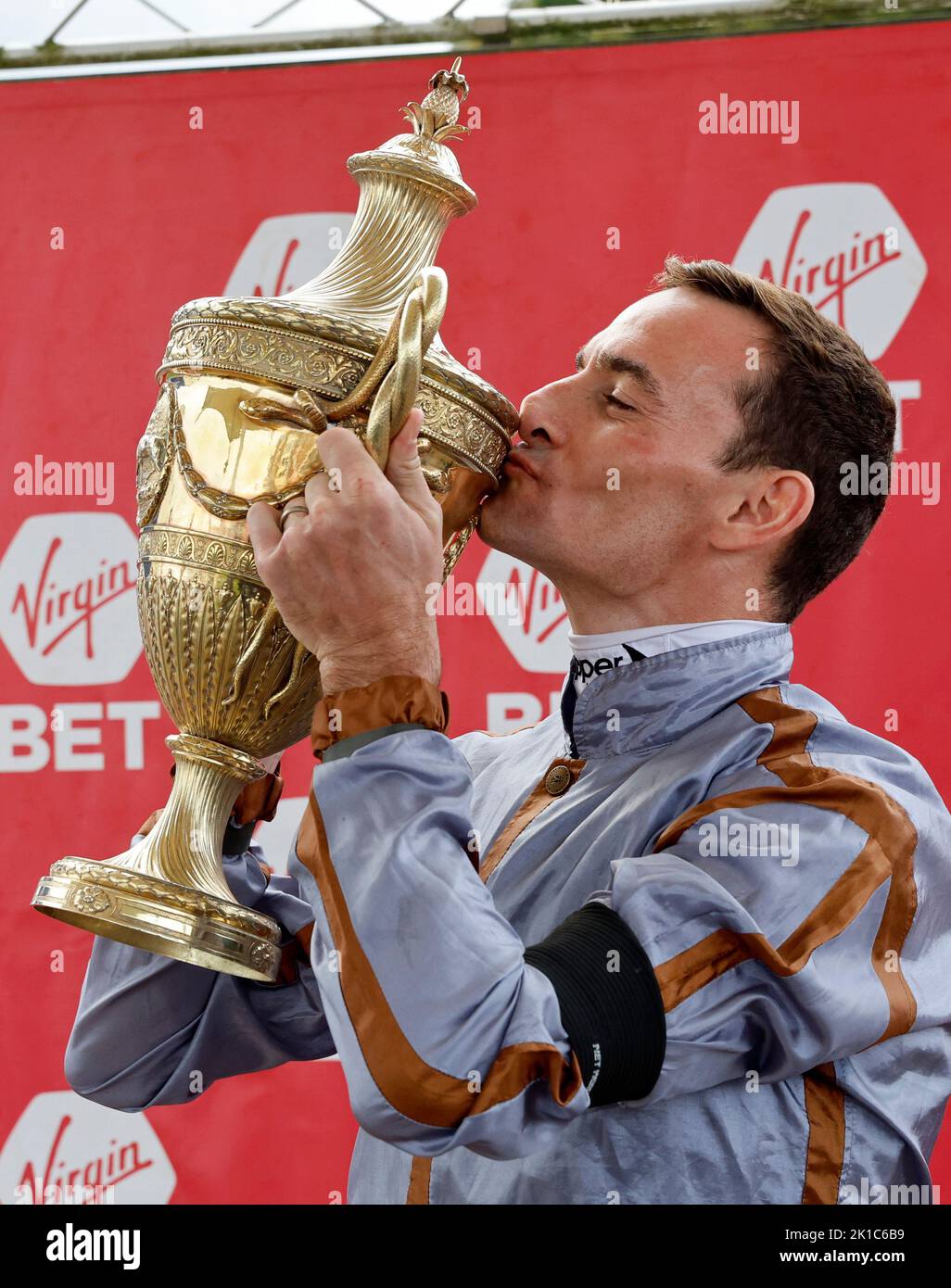 Jockey Daniel Tudhope with the trophy after winning the Virgin Bet Ayr Gold Cup Handicap on Summerghand during the Virgin Bet Ayr Gold Cup day at Ayr Racecourse, Ayr. Picture date: Saturday September 17, 2022. Stock Photo