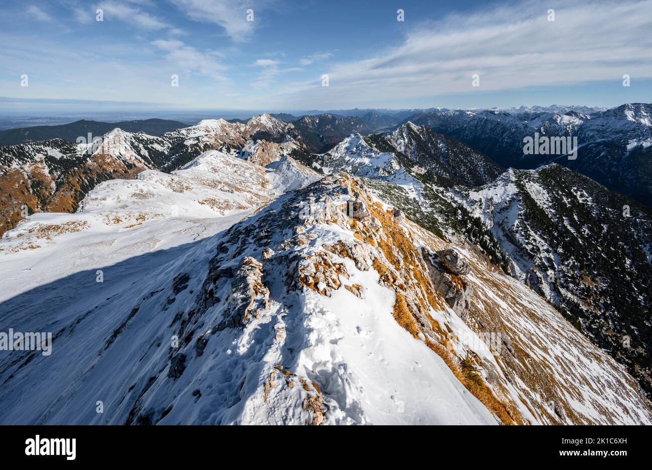Narrow rocky snowy ridge of the Ammergauer Hochplatte, view towards Loesertaljoch, view of mountain panorama, hiking to the Ammergauer Hochplatte, in Stock Photo