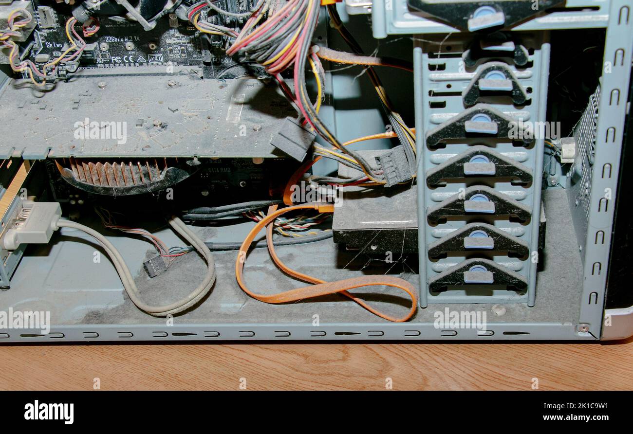 A thick layer of dust covers the internal electronic components of the