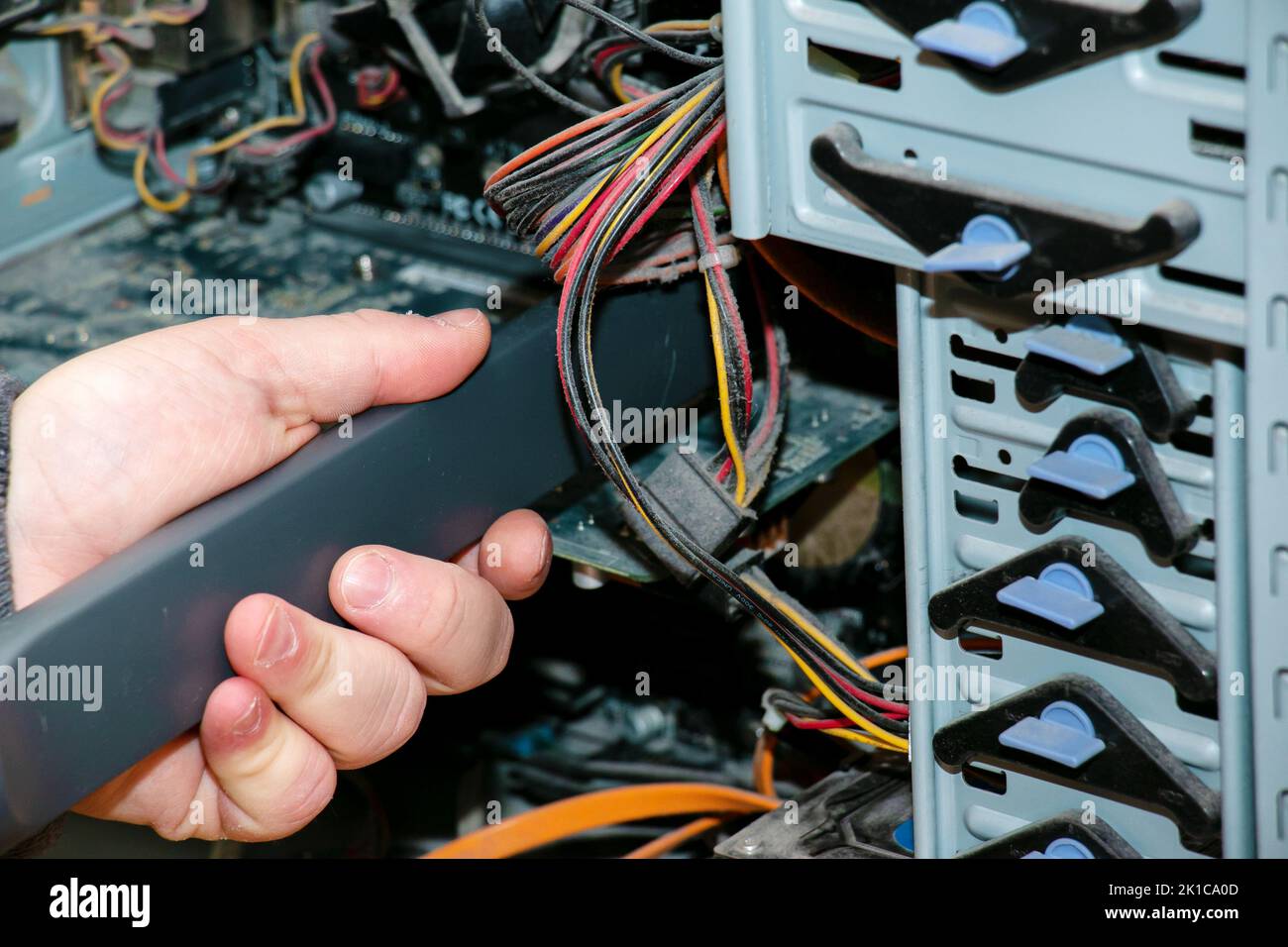 Cleaning the system unit of a desktop computer from dust using a vacuum