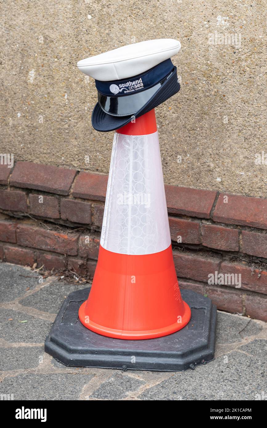 Hat of a Southend on Sea Borough Council traffic warden placed on a traffic cone. Oddity Stock Photo