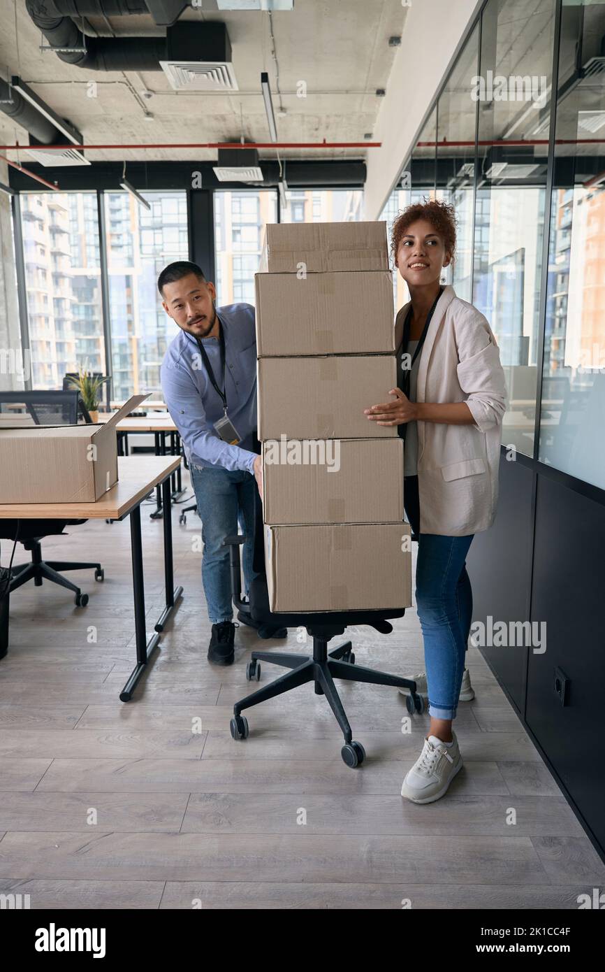 Two young company employees conducting office move Stock Photo Alamy