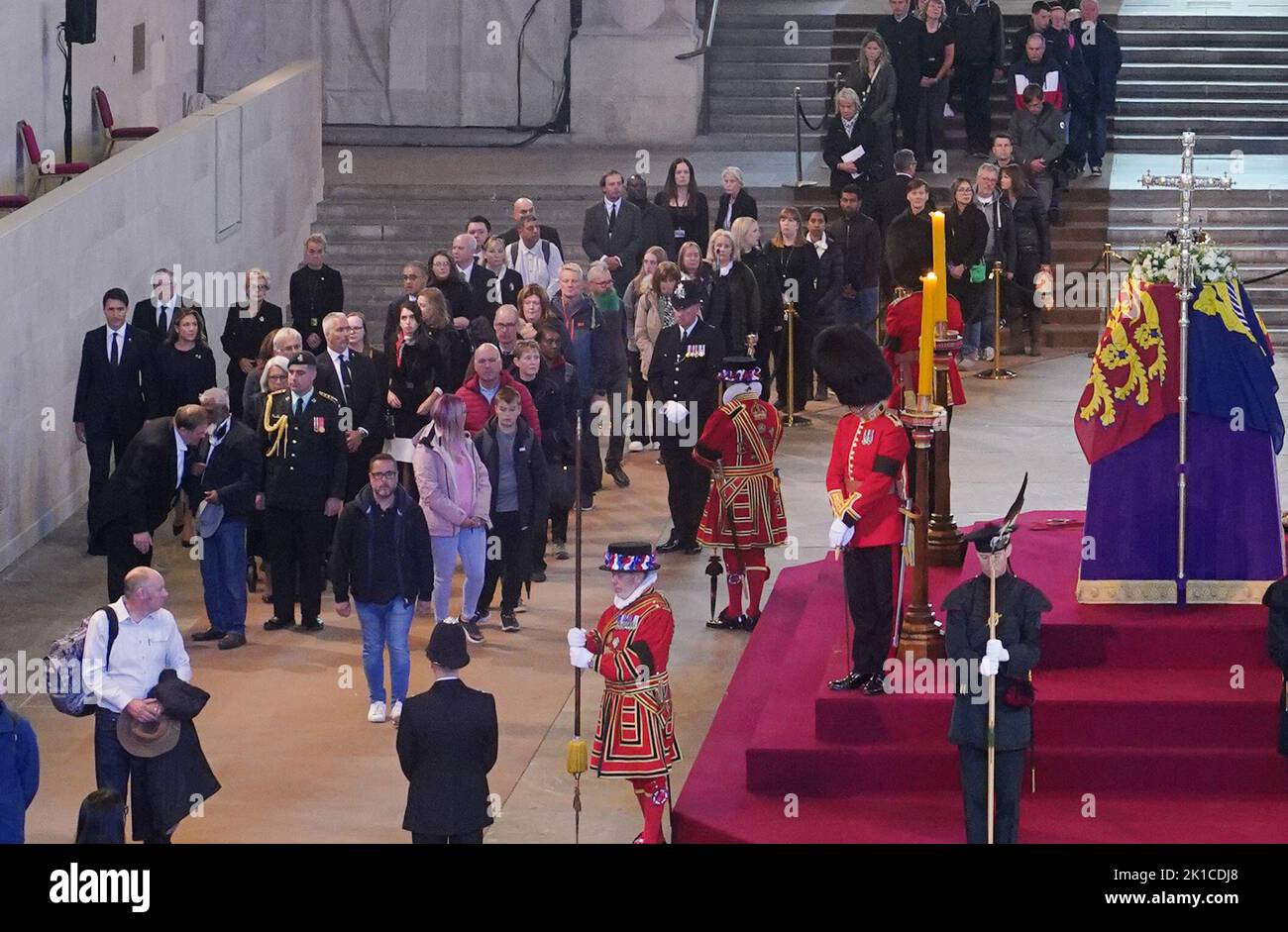 Prime Minister of Canada, Justin Trudeau (far left), views the coffin of Queen Elizabeth II, draped in the Royal Standard with the Imperial State Crown and the Sovereign's orb and sceptre, lying in state on the catafalque in Westminster Hall, at the Palace of Westminster, London, ahead of her funeral on Monday. Picture date: Saturday September 17, 2022. Stock Photo