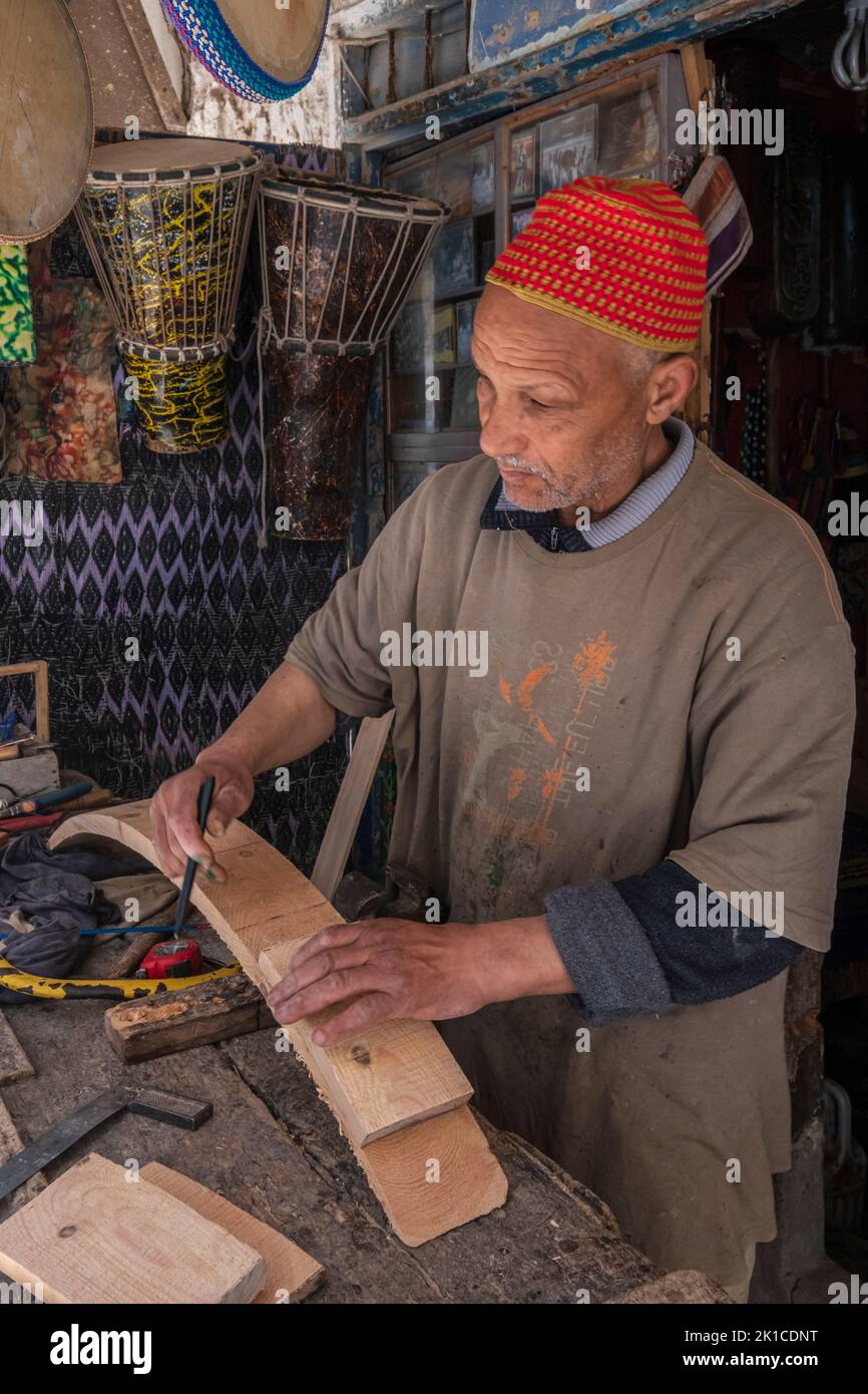 craftsman luthier making a musical instrument, Essaouira, morocco