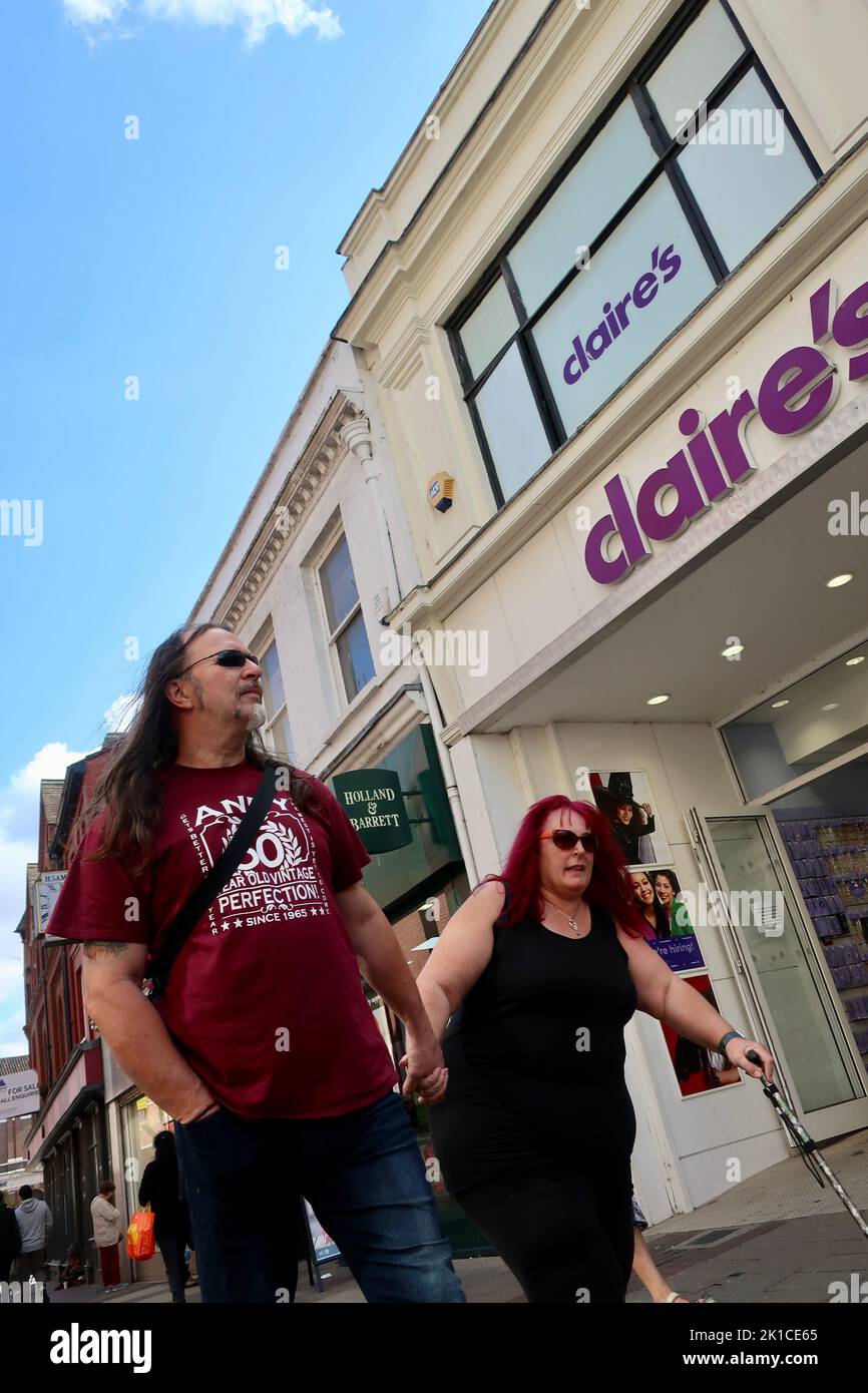 Ipswich, Suffolk, UK - 17 September 2022 : A couple walk past Claire’s in the town centre. Stock Photo