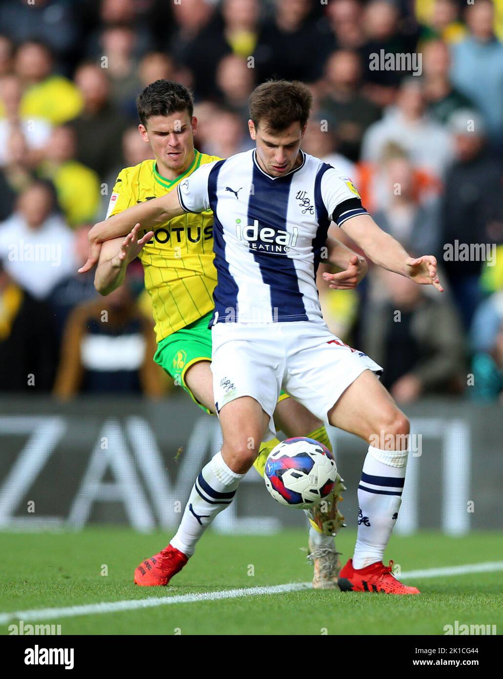 Norwich City's Sam Byram (left) and West Bromwich Albion's Jayson Molumby battle for the ball during the Sky Bet Championship match at Carrow Road, Norwich. Picture date: Saturday September 17, 2022. Stock Photo