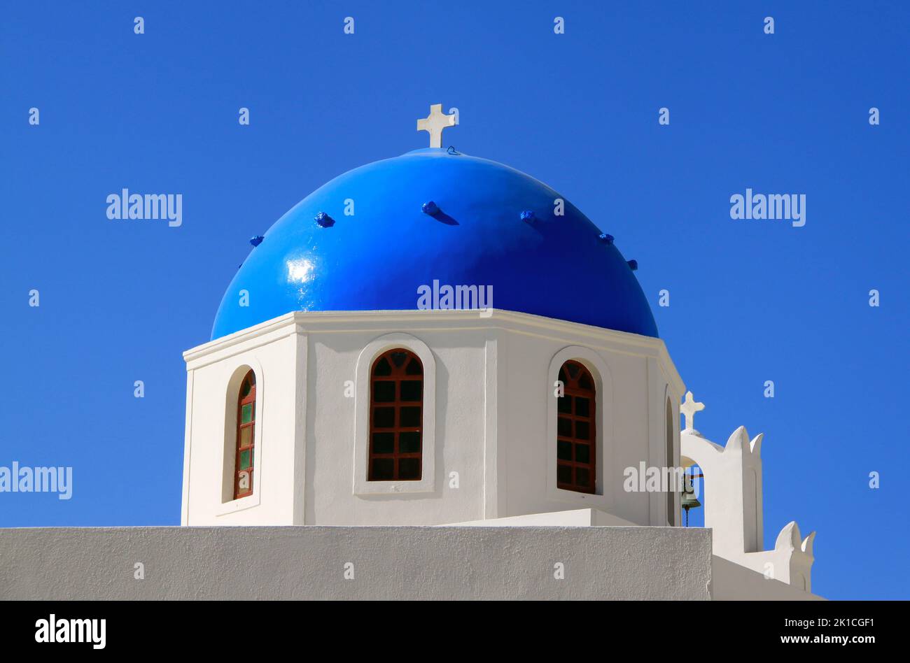 Beautiful blue dome of Anastasis church in Oia, Santorini on a sunny day with blue sky. Stock Photo