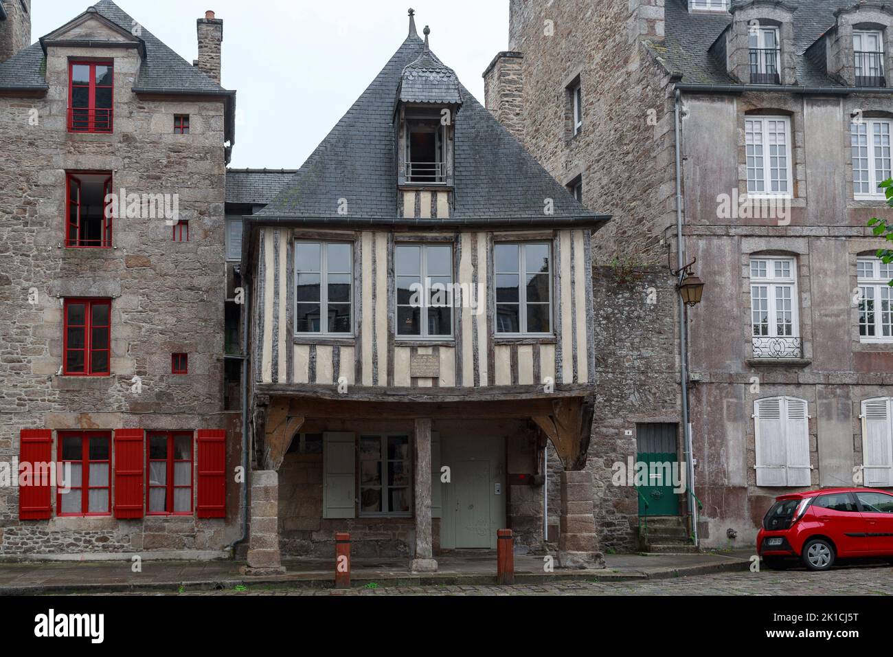 DINAN, FRANCE - SEPTEMBER 4, 2019: These are residential stone and half-timbered houses of the medieval Saint Sauveur square. Stock Photo