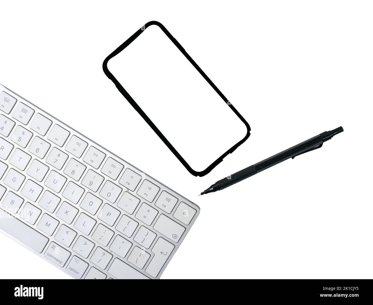 computer keyboard, cell phone and pen isolated on a white background Stock Photo