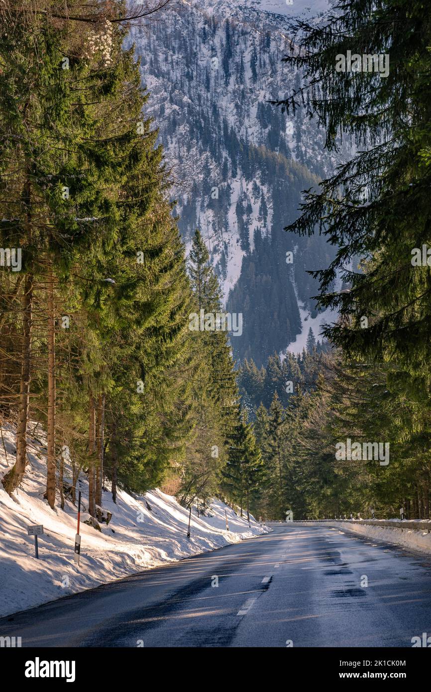 Road in mountainous winter landscape, Berchtesgaden, Bavaria, Germany Stock Photo